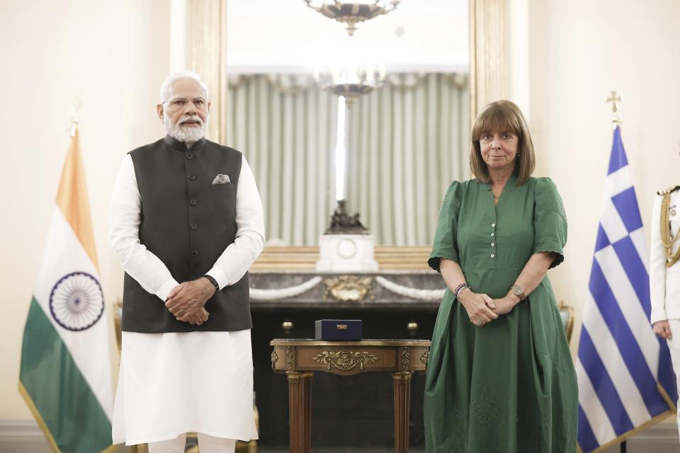 In this photo provided by the Greek President's office, Greece's President Katerina Sakellaropoulou, right, and Indian Prime Minister Narendra Modi join a meeting at the Presidential Palace in Athens, Greece, Friday, Aug. 25, 2023. Modi's visit to Athens is especially significant for Greek foreign policy as it is the first official visit by an Indian prime minister to Greece in 40 years. (Theodore Manolopoulos/Presidency of Hellenic Republic via AP)