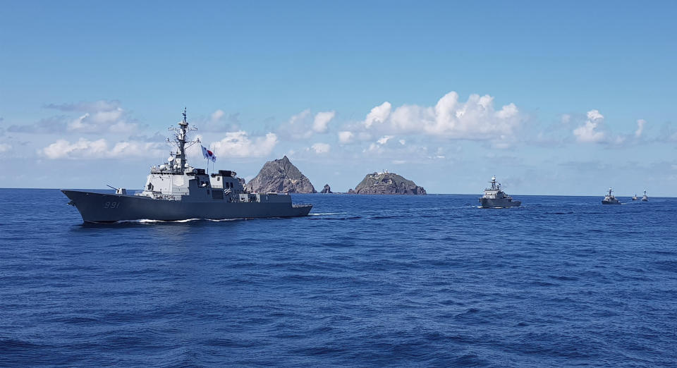 In this photo provided by South Korea's Navy, South Korean Navy's Aegis destroyer, King Sejong the Great, sails during the drill near the islets called Dokdo in Korean and Takeshima in Japanese, Sunday, Aug. 25, 2019. In a development that could possibly further complicate ties between Seoul and Tokyo, South Korea's navy on Sunday began two-day exercises on and around a group of islets controlled by South Korea but also claimed by Japan. (South Korea's Navy via AP)