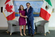 Canadian Minister of Foreign Affairs Chrystia Freeland shakes hands with Mexican Secretary of Economy Ildefonso Guajardo Villarreal before the first round of talks to renegotiate the North American Free Trade Agreement (NAFTA) at the Embassy of Canada in Washington, U.S., August 15, 2017. REUTERS/Joshua Roberts