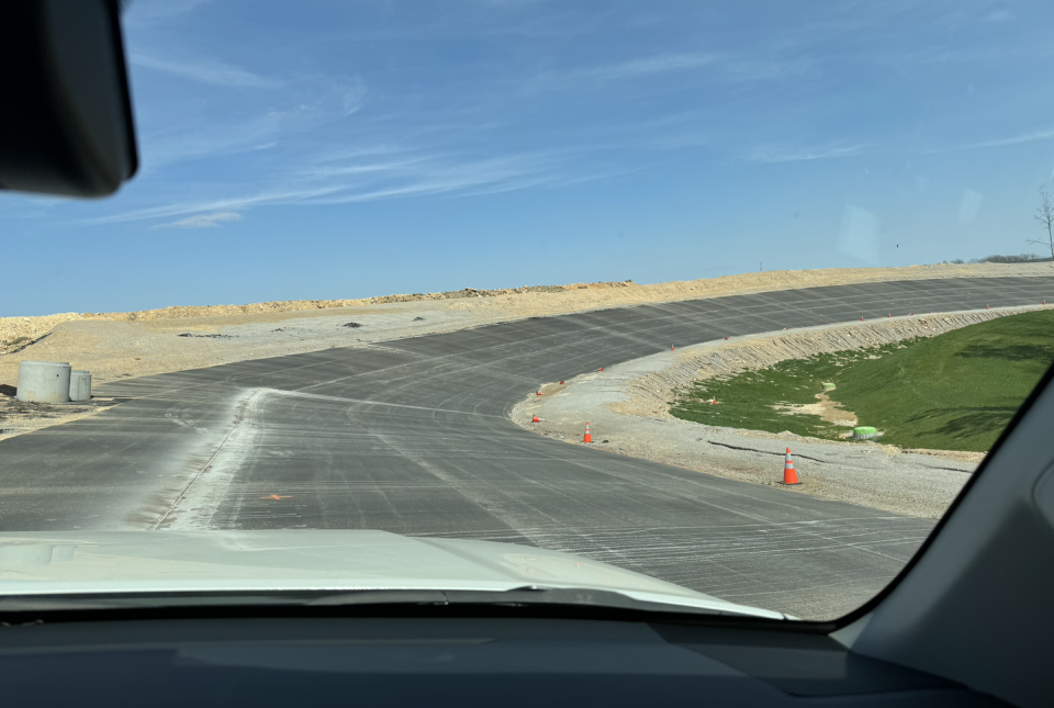 a road with a cone on the side