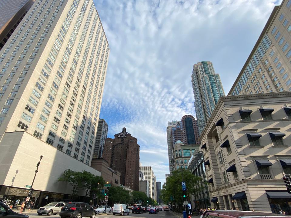 the sun shining over a street in Chicago