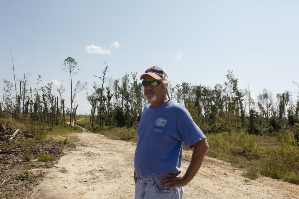 Joe Leonard stands on his property in Blounstown, Fla. The family's timber business was devastated by Hurricane Michael a year ago. The massive storm killed more than two dozen people in northern Florida, destroyed hundreds of homes and brought catastrophic damage to the region’s timber industry. (AP Photo/Bobby Caina Calvan)