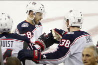 Columbus Blue Jackets center Boone Jenner (38) congratulates Columbus Blue Jackets right wing Oliver Bjorkstrand (28) after Bjorkstrand scored a goal during the third period of an NHL hockey game, Sunday, Jan. 19, 2020, in New York. Bjorkstrom scored both goals as the Blue Jackets defeated the Rangers 2-1. (AP Photo/Kathy Willens)