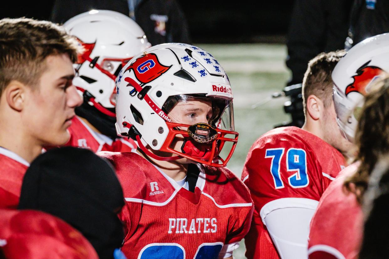 Garaway's Dillon Soehnlen listens to coaches address the team after their 17-0 loss to Kirtland in the Division VI, Region 23 State Semifinal game, Friday, Nov. 24 at the Louisville Leopards’ Stadium in Louisville, Ohio. This was the first time in program history that Garaway has competed in a State Semifinal game.