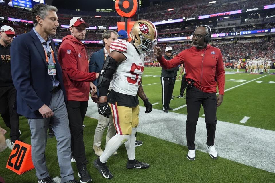 San Francisco 49ers linebacker Dre Greenlaw (57) is helped after an injury against the Kansas City Chiefs during the first half of the NFL Super Bowl 58 football game Sunday, Feb. 11, 2024, in Las Vegas. (AP Photo/Ashley Landis)