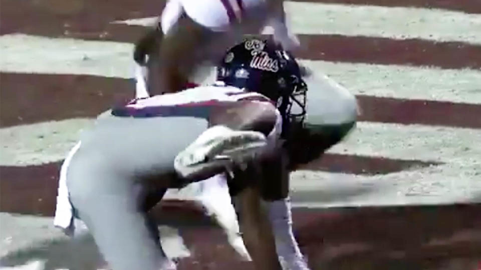 Ole Miss receiver Elijah Moore crawling along the turf for this bizarre dog urinating celebration.