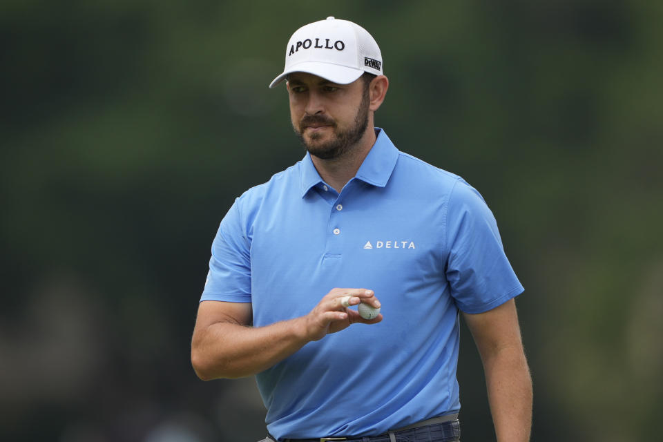 Patrick Cantlay waves after making a putt on the fifth hole during the second round of the RBC Heritage golf tournament, Friday, April 19, 2024, in Hilton Head Island, S.C. (AP Photo/Chris Carlson)