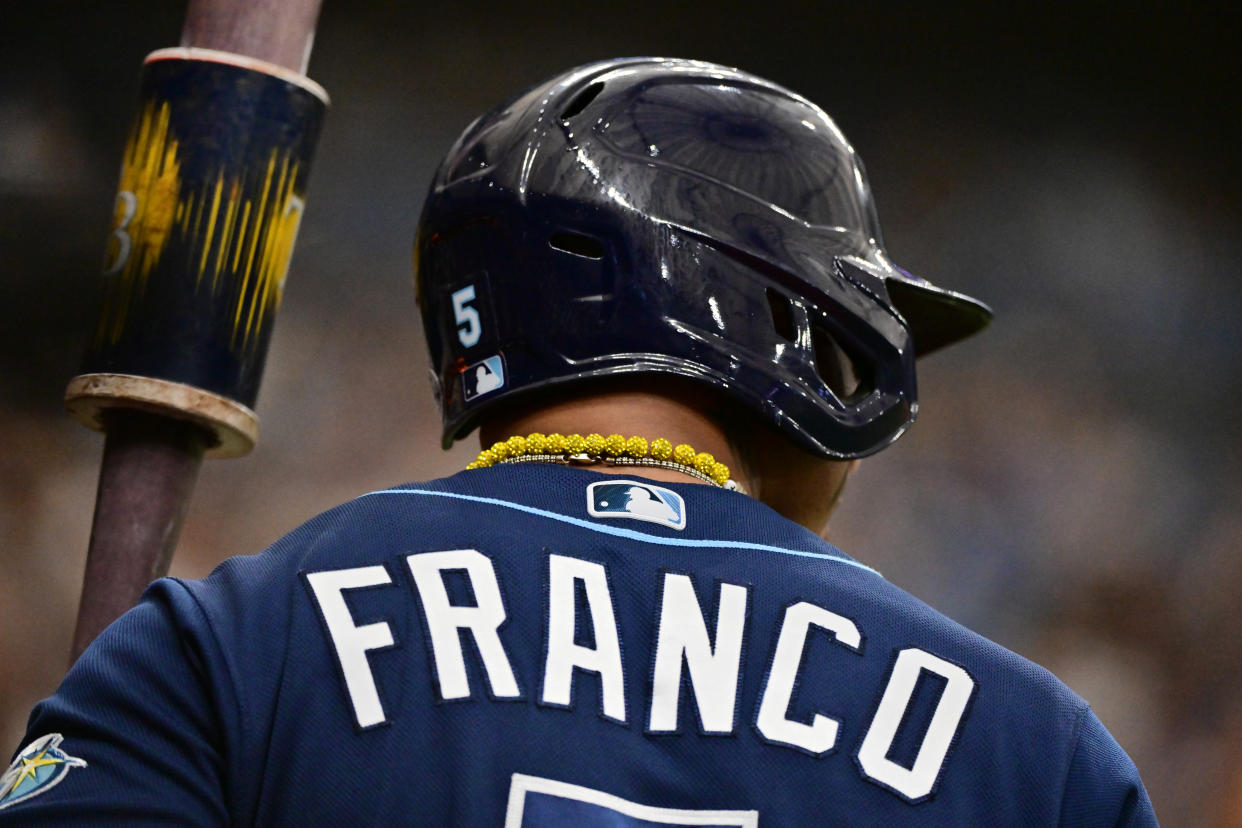 Wander Franco sports his yellow baubles during an April game at Tropicana Field. (Photo by Julio Aguilar/Getty Images)