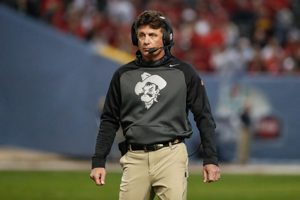 PHOENIX, AZ - DECEMBER 27:  Oklahoma State Cowboys head coach Mike Gundy looks on during the college football Guaranteed Rate Bowl game between the Wisconsin Badgers and the Oklahoma State Cowboys on December 27, 2022 at Chase Field in Phoenix, Arizona. (Photo by Kevin Abele/Icon Sportswire via Getty Images)