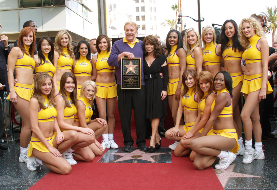 Dr. Jerry Buss (C), poses with former Laker girl Paula Abdul and the current Laker Girls after Buss is honored with a television star on the Hollywood Walk of Fame on October 30, 2006 in Hollywood, California. (Photo by Andrew D. Bernstein/NBAE/Getty Images)