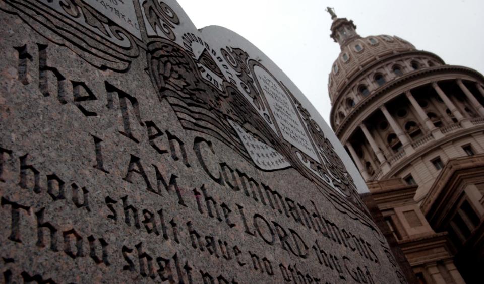A statue of the "Ten Commandments" is displayed on the grounds of the Texas State Capitol in this March 2, 2005 photo.
(Credit: Matt Rourke/AMERICAN-STATESMAN/File)