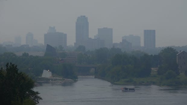 The Gatineau, Que., skyline is obscured by a hazy smog as smoke from fires burning in northwestern Ontario and Manitoba filled the air on Monday. (Ian Black/CBC News - image credit)