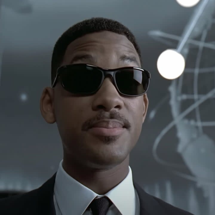 Will Smith in sunglasses and a suit