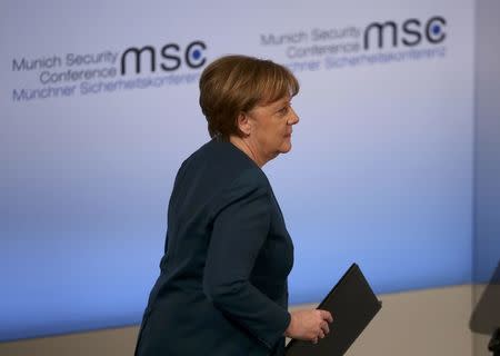 German Chancellor Angela Merkel walks before delivering her speech during the 53rd Munich Security Conference in Munich, Germany, February 18, 2017. REUTERS/Michael Dalder
