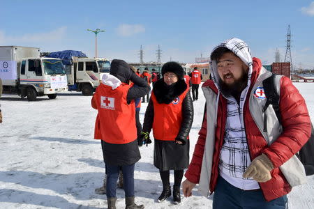Red cross workers prepare to send trucks to deliver food and monetary aid to eight provinces over Mongolia's vast steppe, mountains and frozen rivers from Ulan Bator, Mongolia, February 26, 2016. Global aid agencies are responding to a call for assistance by Mongolia as harsh winter weather raises fears for the safety and livelihoods of the country's traditional pastoralists, who have already been hit hard by a drought last year. Picture taken February 26, 2016. REUTERS/Terrence Edwards EDITORIAL USE ONLY. NO RESALES. NO ARCHIVE