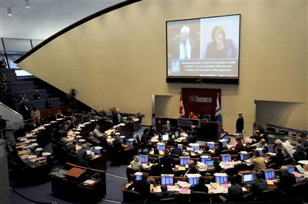 Toronto Mayor Rob Ford (L on screen) addresses Toronto City Solicitor Anna Kinastowski (R on screen) during a city council meeting in Toronto November 15, 2013. REUTERS/Jon Blacker