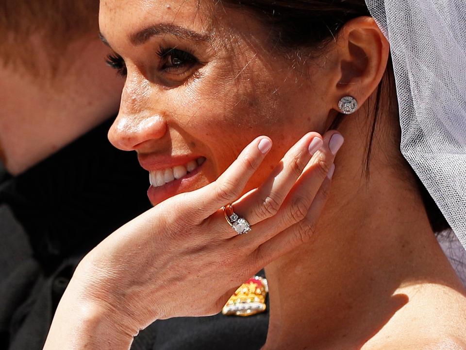 Prince Harry, Duke of Sussex and The Duchess of Sussex leave Windsor Castle in the Ascot Landau carriage during a procession after getting married