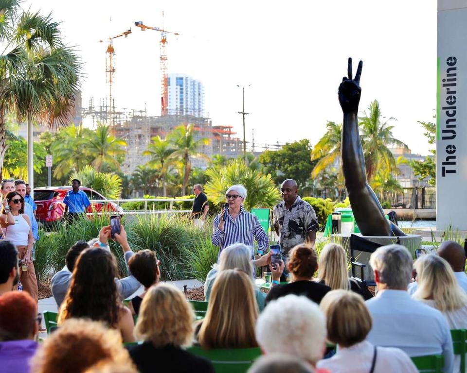 A crowd listens to a talk between Knight Foundation vice president of arts Victoria Rogers and artist Hank Willis Thomas at the unveiling of his sculpture “Duality” at The Underline on May 17.