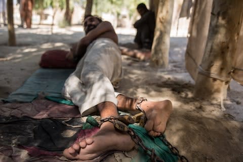 At the shrine people stay chained to trees for 40 days, after which they are allegedly 'cured' - Credit: Stefanie Glinski