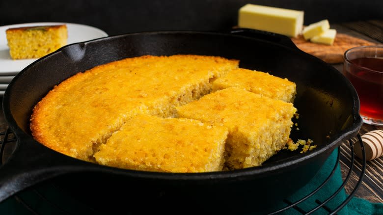 Cornbread in skillet with butter