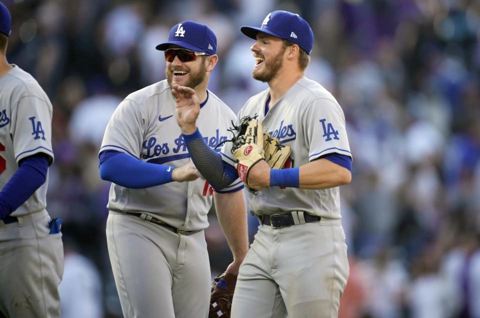Dodgers second baseman Gavin Lux and third baseman Max Muncy celebrate.