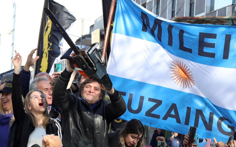 Javier Milei takes a chainsaw to traditional politics in Argentina – at least figuratively speaking