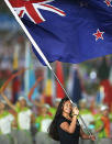 Gabrielle Fa'amausili of New Zealand holds the national flag during the opening ceremony for the Nanjing 2014 Summer Youth Olympic Games