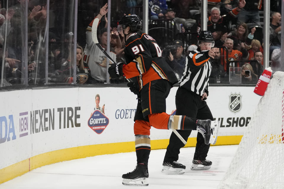 Anaheim Ducks center Leo Carlsson (91) celebrates after scoring for a hat trick during the third period of an NHL hockey game against the Philadelphia Flyers in Anaheim, Calif., Friday, Nov. 10, 2023. (AP Photo/Ashley Landis)