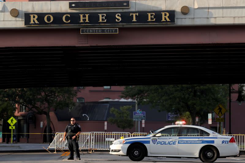 FILE PHOTO: A member of the Rochester Police Department prepares for the start of protests in Rochester, New York