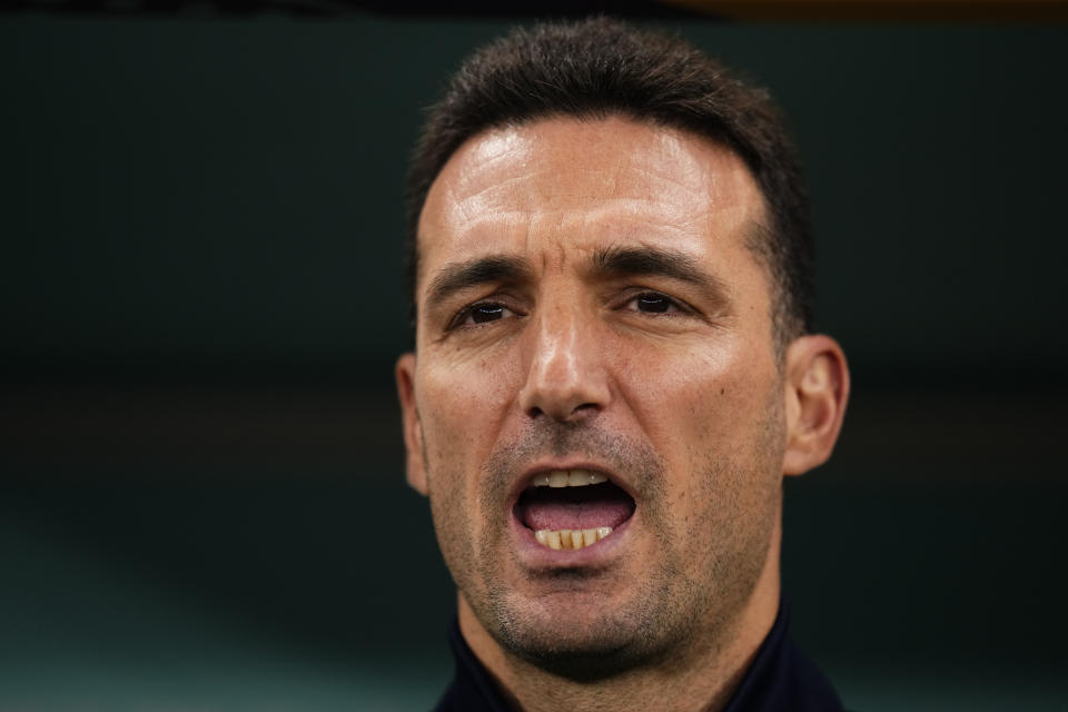 Argentina's head coach Lionel Scaloni sings national anthem before the World Cup semifinal soccer match between Argentina and Croatia at the Lusail Stadium in Lusail, Qatar, Tuesday, Dec. 13, 2022. (AP Photo/Manu Fernandez)