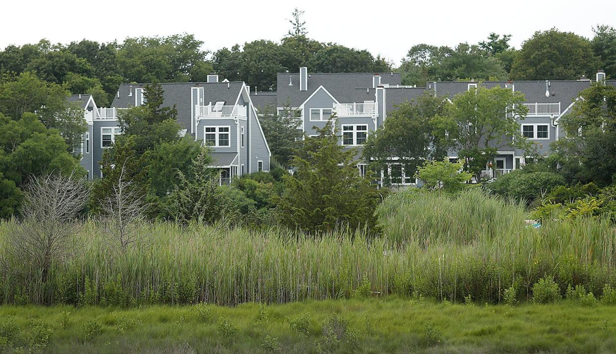 Townhouses line the Weir River at the former Hall Estate property in Hull near the Hingham/Cohasset town line Friday, July 14, 2023.