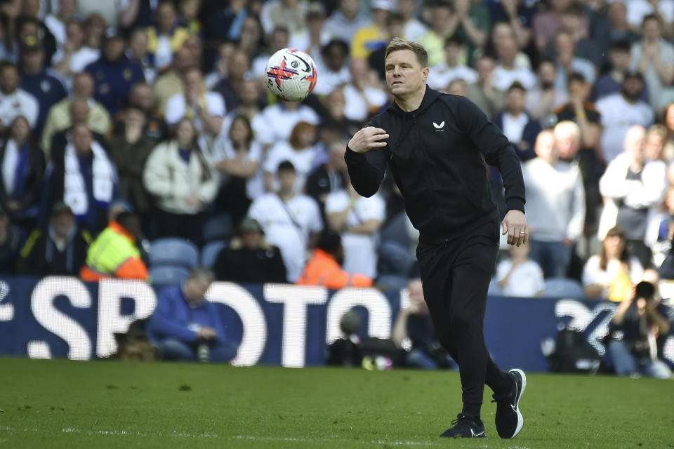Newcastle's head coach Eddie Howe throws the ball as he leaves the field at the end of the English Premier League soccer match between Leeds United and Newcastle United at Elland Road in Leeds, England, Saturday, May 13, 2023. The match ended tied 2-2. (AP Photo/Rui Vieira)
