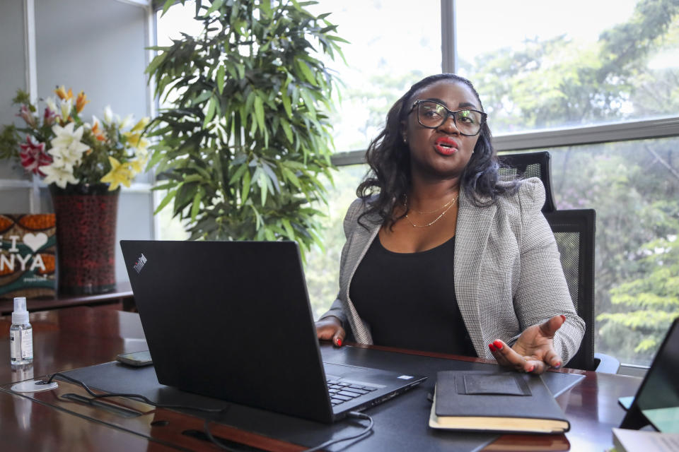 Kenyan senator Gloria Orwoba speaks to the Associated Press at her office in Nairobi, Kenya, Monday, Feb. 27, 2023. Orwoba has said that she attended parliament last month while wearing a white pantsuit stained by her menstruation in order to combat the stigma surrounding women's monthly periods. (AP Photo/Brian Inganga)