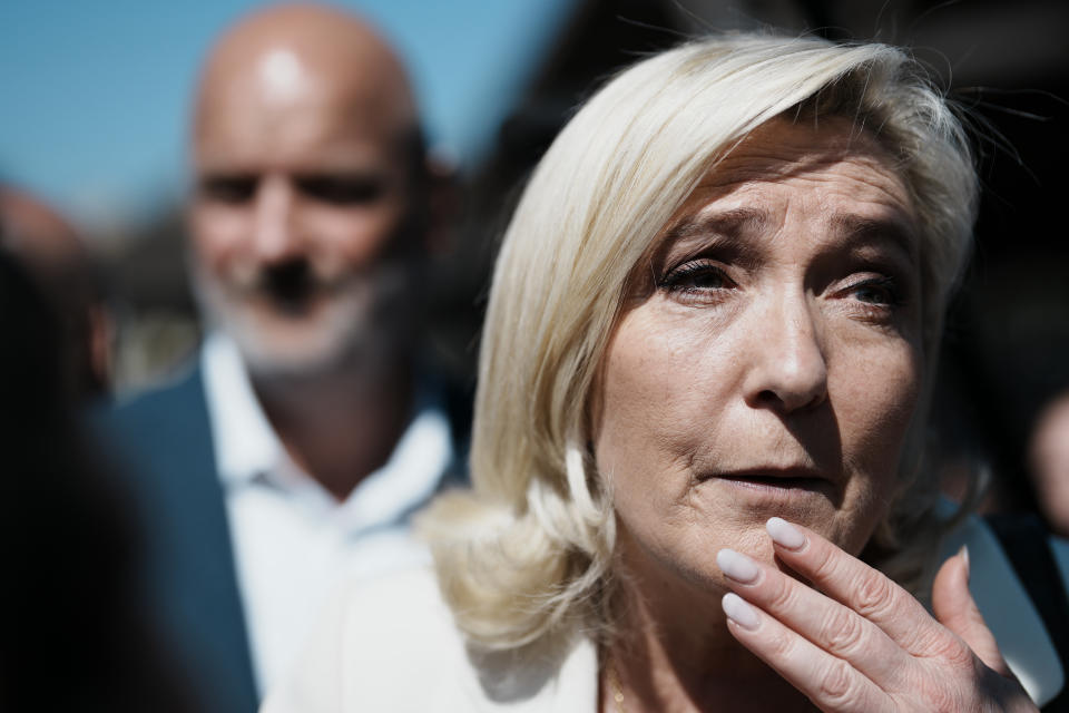 French far-right leader Marine Le Pen reacts as she campaigns in Saint-Remy-sur-Avre, western France, Saturday, April 16, 2022. Marine Le Pen is trying to unseat centrist President Emmanuel Macron, who has a slim lead in polls ahead of France's April 24 presidential runoff election. (AP Photo/Thibault Camus)