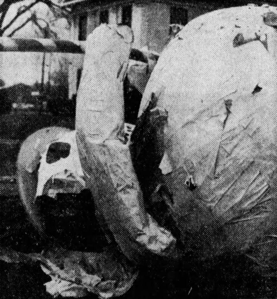 The Tallmadge snowman is toppled and torn after a windstorm in December 1970.