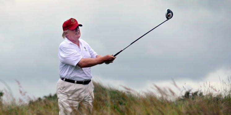 Donald Trump golfing at Trump International Golf Links course in Aberdeenshire, Scotland