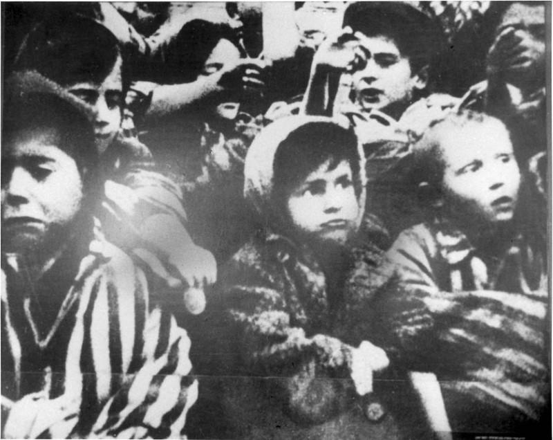 A group of children are seen after the liberation of the Nazi German death camp Auschwitz-Birkenau in 1945 in Nazi-occupied Poland, in this handout