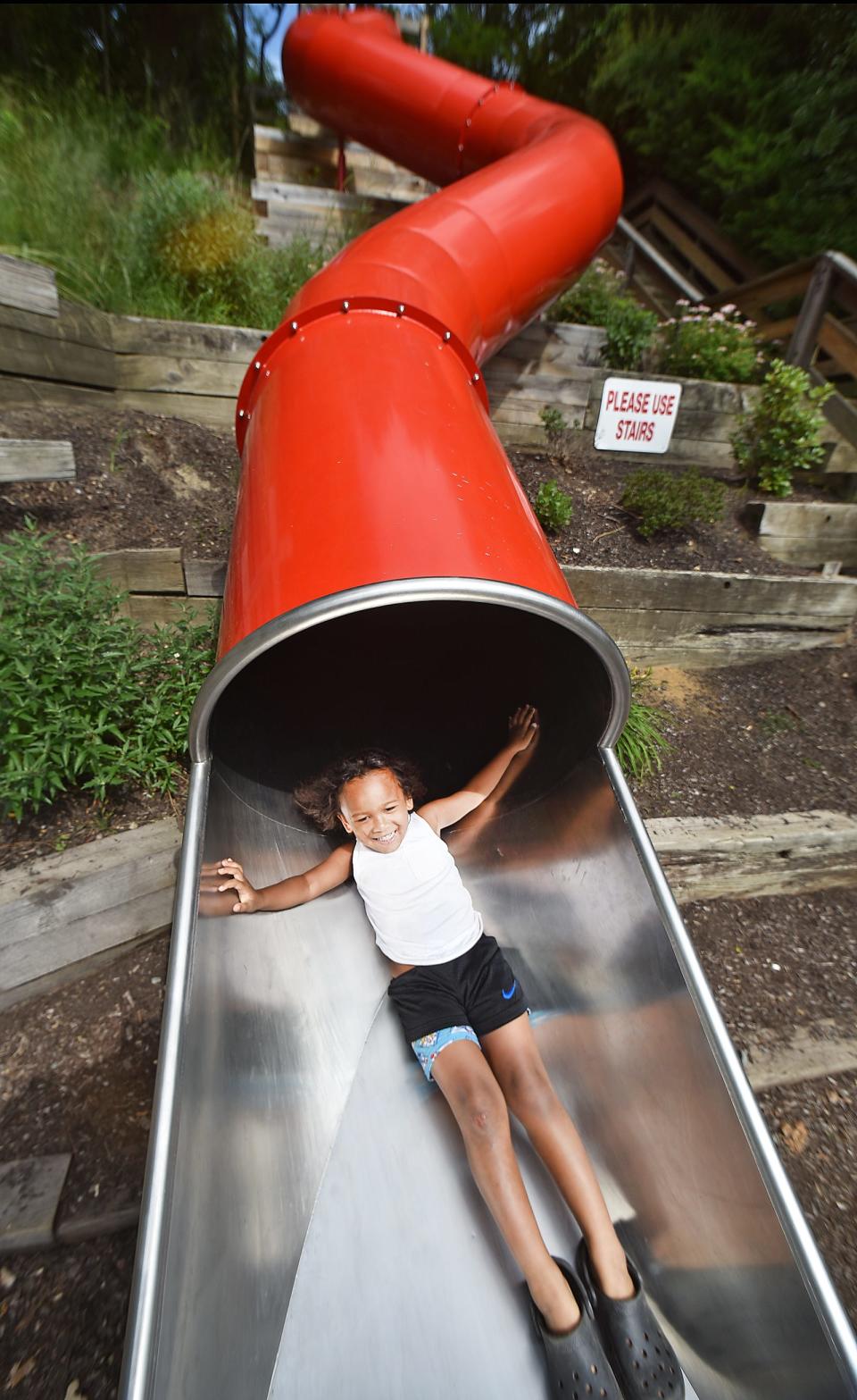 Kordyll Aosa of Fall River on the big red slide at Pierce Beach in Somerset.