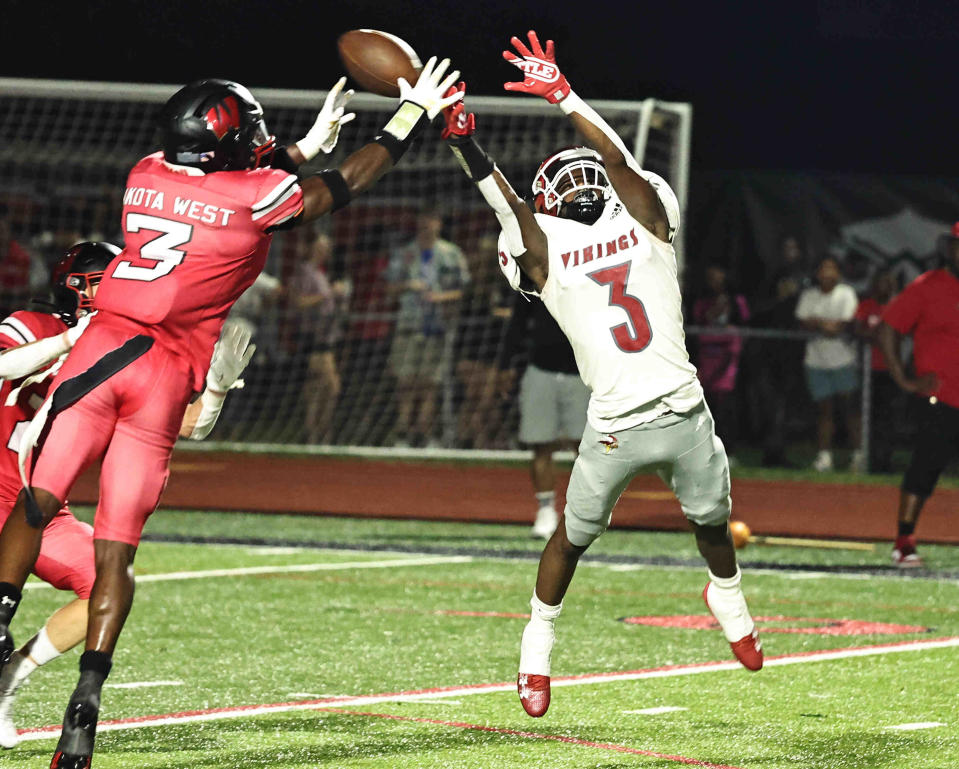 Princeton wide receiver Antonio Hunter (3) and Lakota West defensive back Taebron Bennie-Powell (3) battle for the ball during their football game Friday, Aug. 25 , 2023.