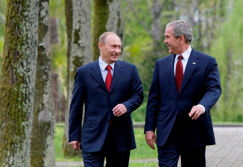 U.S. President George Bush, left, and Russian President Vladimir Putin walk to a joint press conference in the Black Sea resort city of Sochi, southern Russia, Sunday, April 6, 2008.