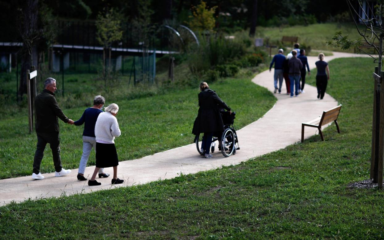 Alzheimer's patients at the specially-constructed Village Landais Alzheimer site in Dax, France - Gonzalo Fuentes/Reuters