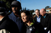 Oakland City Council Member Larry Reid (L) embraces Mayor Libby Schaaf after a new conference at the scene of a fire in the Fruitvale district of Oakland, California, U.S. December 3, 2016. REUTERS/Stephen Lam