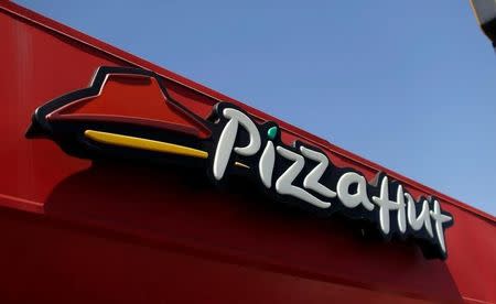 The sign at a Pizza Hut location, which is owned by Yum Brands Inc, is pictured ahead of their company results in Pasadena, California U.S., July 11, 2016. REUTERS/Mario Anzuoni