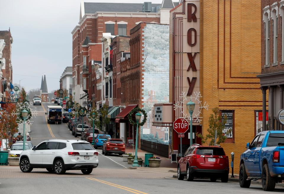 Shoppers visiting downtown around mid-day park in downtown next to the Roxy Regional Theatre in Clarksville, Tenn., on Monday, Dec. 7, 2020.