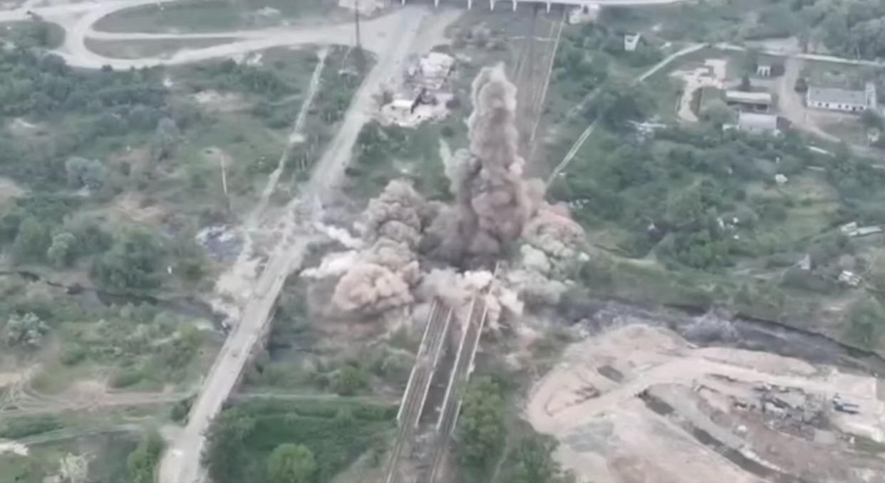 An aerial view of an explosion after a joint operation to blow up a bridge.