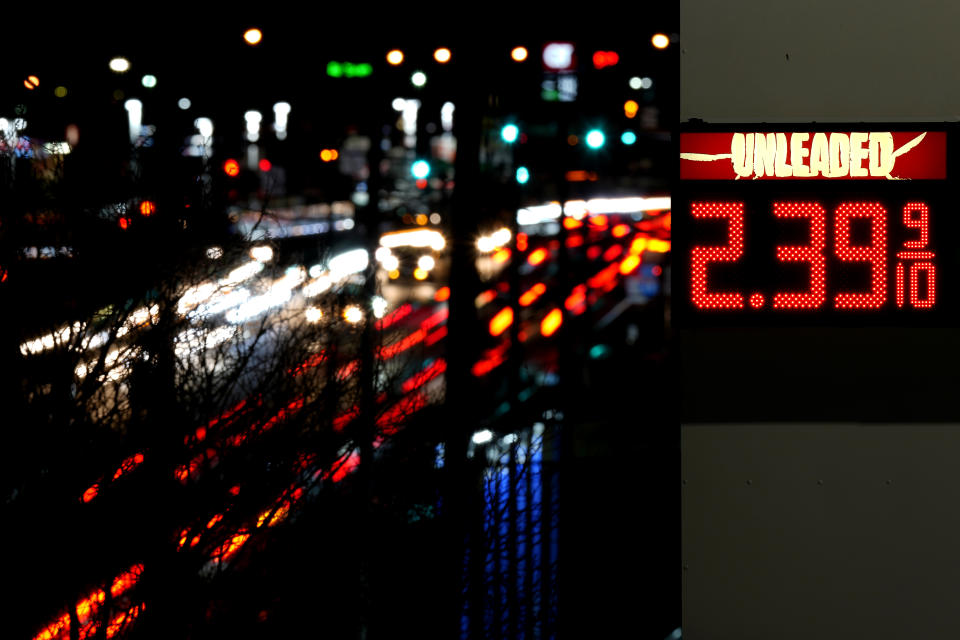 Cars blur past a gas station sign displaying the price of regular unleaded gasoline Tuesday, Dec. 13, 2022, in Benton, Mo. Drivers in the U.S. and Europe are getting a break from the record-high pump prices they endured over the summer. But that price tag is still difficult for many customers who have been enduring relentless inflation and were used to lower prices. (AP Photo/Charlie Riedel)