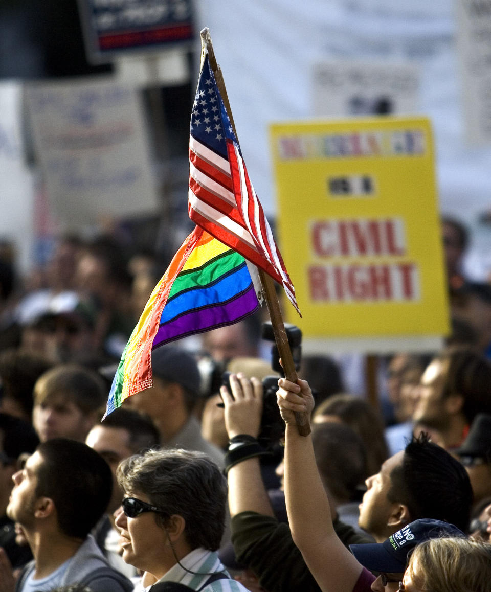 FILE - Protesters march in front of the state Capitol in Sacramento, Calif., Saturday, Nov. 22, 2008, during the latest demonstrations held around the country since Californians adopted Proposition 8, which amended the California Constitution to define marriage as between a man and a woman. California lawmakers are going to try to introduce legislation Tuesday, Feb. 14, 2023, to officially repeal a 15-year-old voter initiative meant to ban same-sex marriage in the state. (AP Photo/Robert Durell, File)