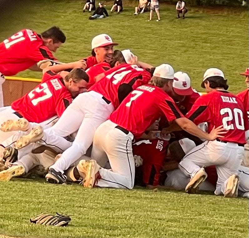 The Hunterdon Central baseball players celebrate after beating Pope John to win the HWS title on May 17, 2023