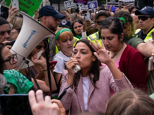 Rep. Alexandria Ocasio-Cortez (D-NY) speaks to abortion-rights activists in front of the U.S. Supreme Court after the Court announced a ruling in the Dobbs v Jackson Women's Health Organization case on June 24, 2022 in Washington, DC.