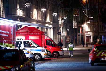 Police and rescue workers are seen near the scene of a shooting in Strasbourg, France, December 12, 2018. REUTERS/Christian Hartmann